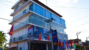 A multi-story building with a modern design, featuring balconies and large windows. - Catamaran 6 Guest Inn (Trincomalee)