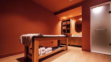 Experience relaxation with a massage table and amenities at your fingertips.