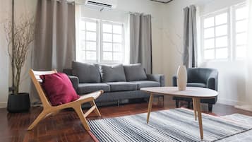 Junior Suite | Living area | 55-inch Smart TV with cable channels