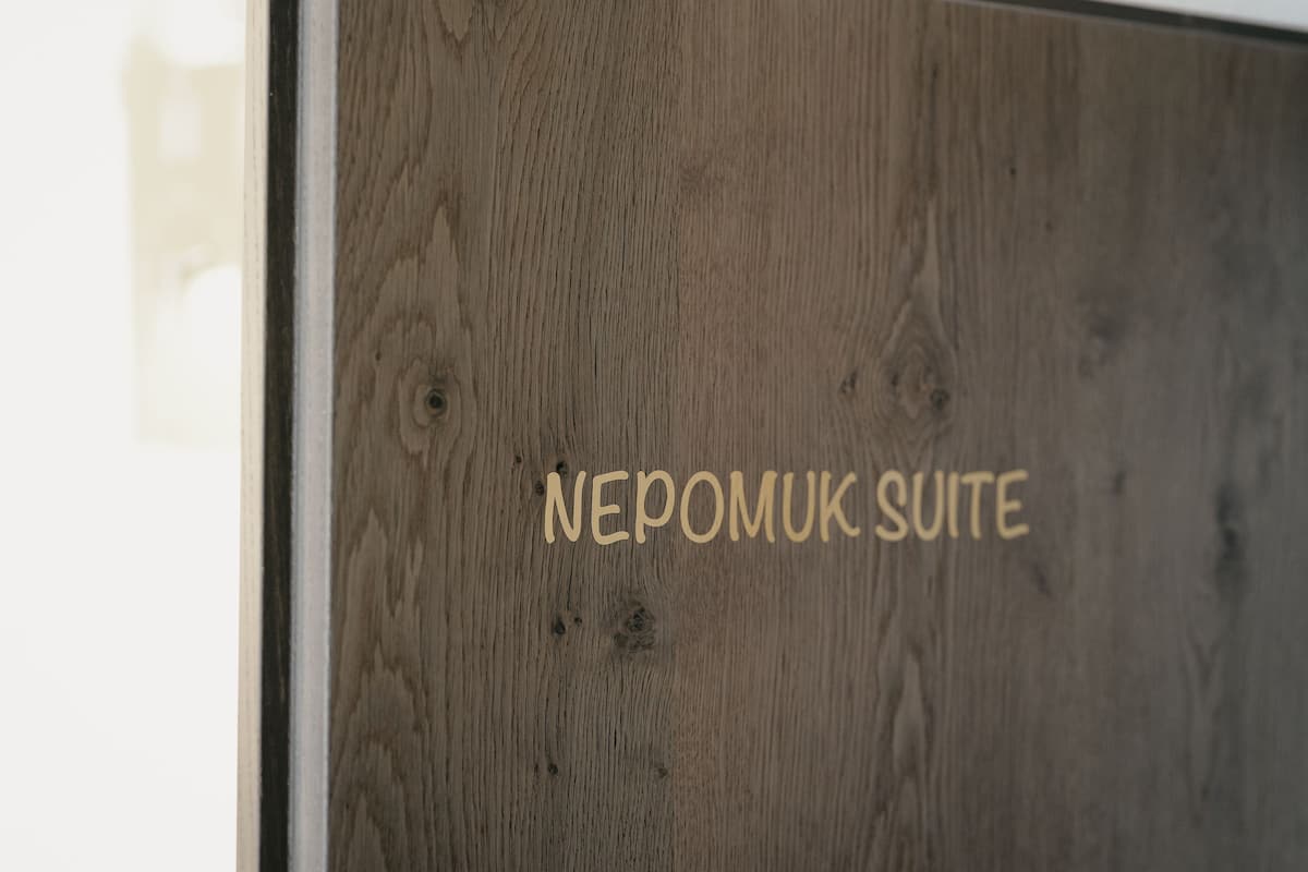 Nepomuk Suite | In-room safe, desk, laptop workspace, blackout curtains