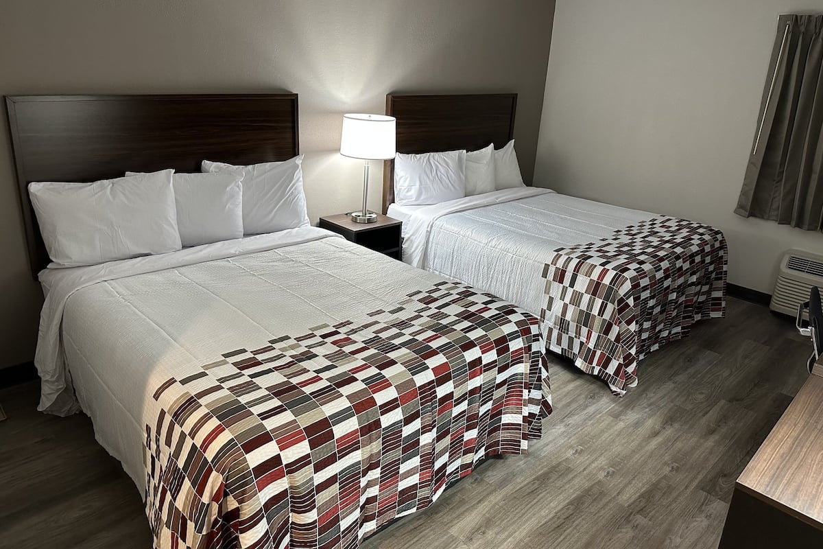 Desk, laptop workspace, blackout drapes, iron/ironing board