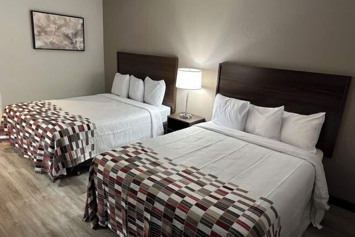 Desk, laptop workspace, blackout drapes, iron/ironing board