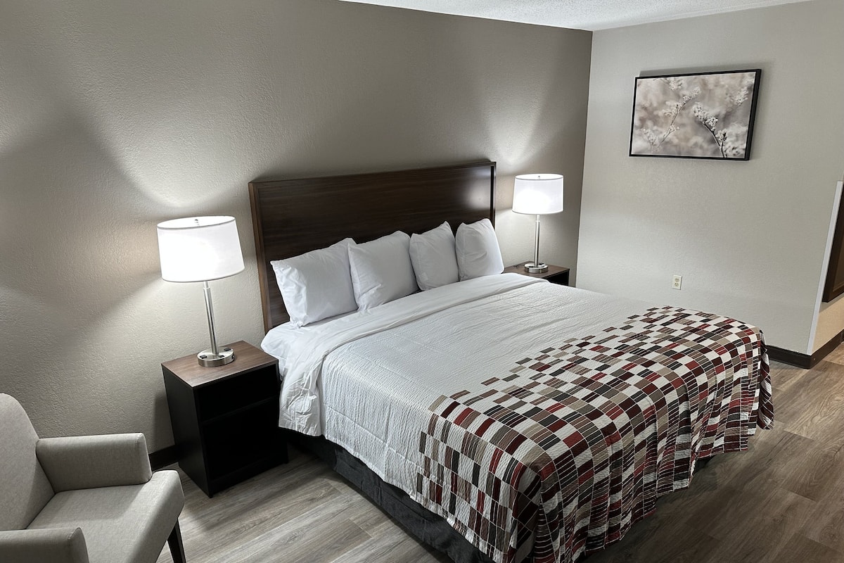 Desk, laptop workspace, blackout drapes, iron/ironing board