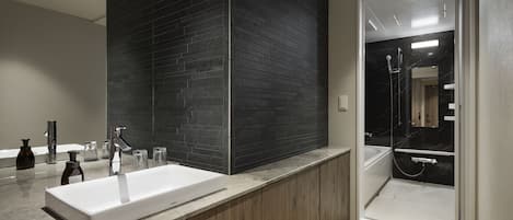 Combined shower/tub, free toiletries, hair dryer, slippers