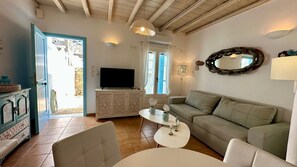 Townhome | Living area | 24-inch flat-screen TV with digital channels