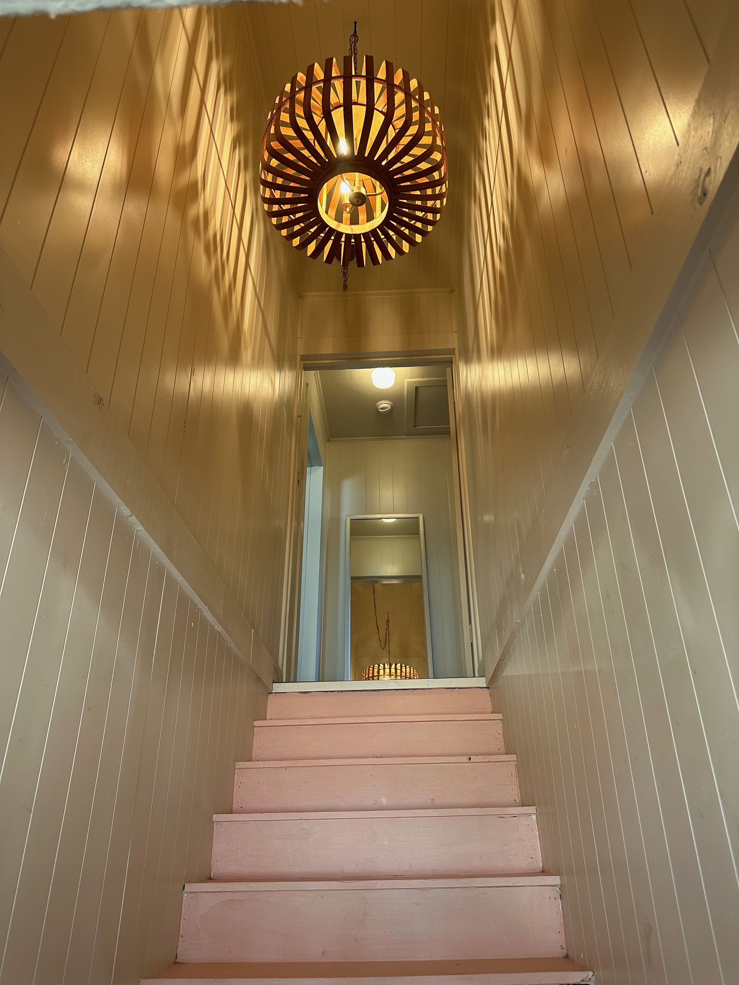 Above the pink stairs ~ a quiet eclectic garage apartment. 