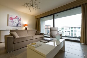 Deluxe appartement | Woonkamer | Een dvd-speler