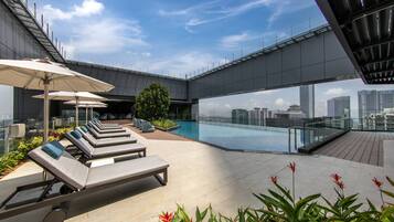Outdoor pool, open 7:00 AM to 10:00 PM, free pool cabanas