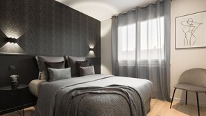 A modern bedroom with a large bed, a bedside table, a chair, and a wall-mounted light fixture.