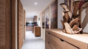 A modern kitchen with wooden cabinetry and a central island. - APPALACHES, Annecy Rent Lodge (Annecy)