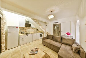 Fridge, stovetop, dishwasher, coffee/tea maker