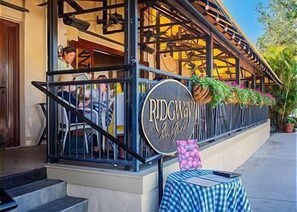 Ridgway offers a charming outdoor seating area with a balcony and potted plants.