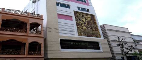 A multi-story building with a prominent sign for 'CREETHAM' on the ground floor.