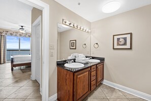 Bathroom features a double vanity with two sinks and a large mirror.