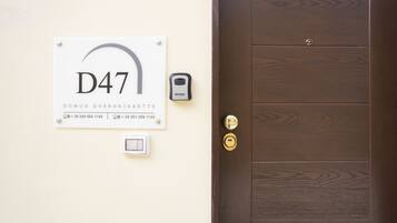 A door with a wooden panel design and a keyhole.