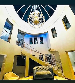 Executive Double Room | Living area | 50-inch LED TV with satellite channels, Netflix, DVD player