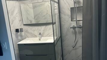 Shower, hair dryer, towels, soap