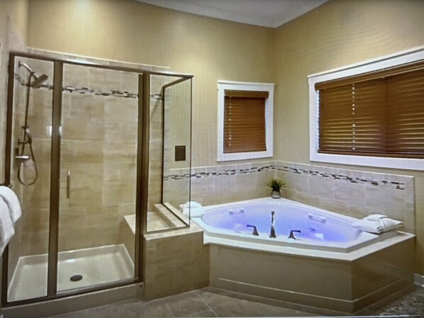 Jetted tub, hair dryer, towels, soap