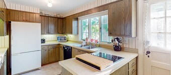 Classic country retreat with a game room, bar, expansive outdoor space, & grill