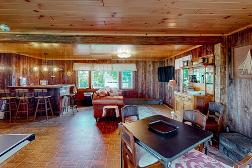 Classic country retreat with a game room, bar, expansive outdoor space, & grill