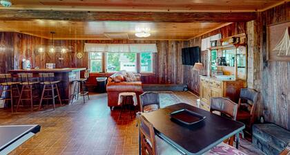 Classic country retreat with a game room, bar, expansive outdoor space, & grill