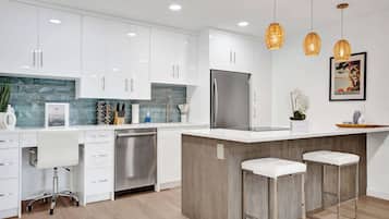 Fridge, stovetop, dishwasher, coffee/tea maker