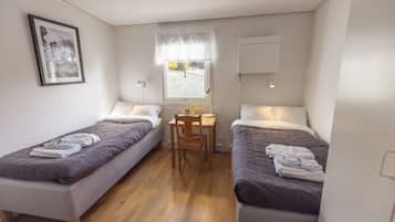 Hypo-allergenic bedding, laptop workspace, blackout curtains