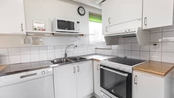 Fridge, microwave, high chair, dining tables