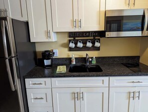 Fridge, microwave, stovetop, coffee/tea maker