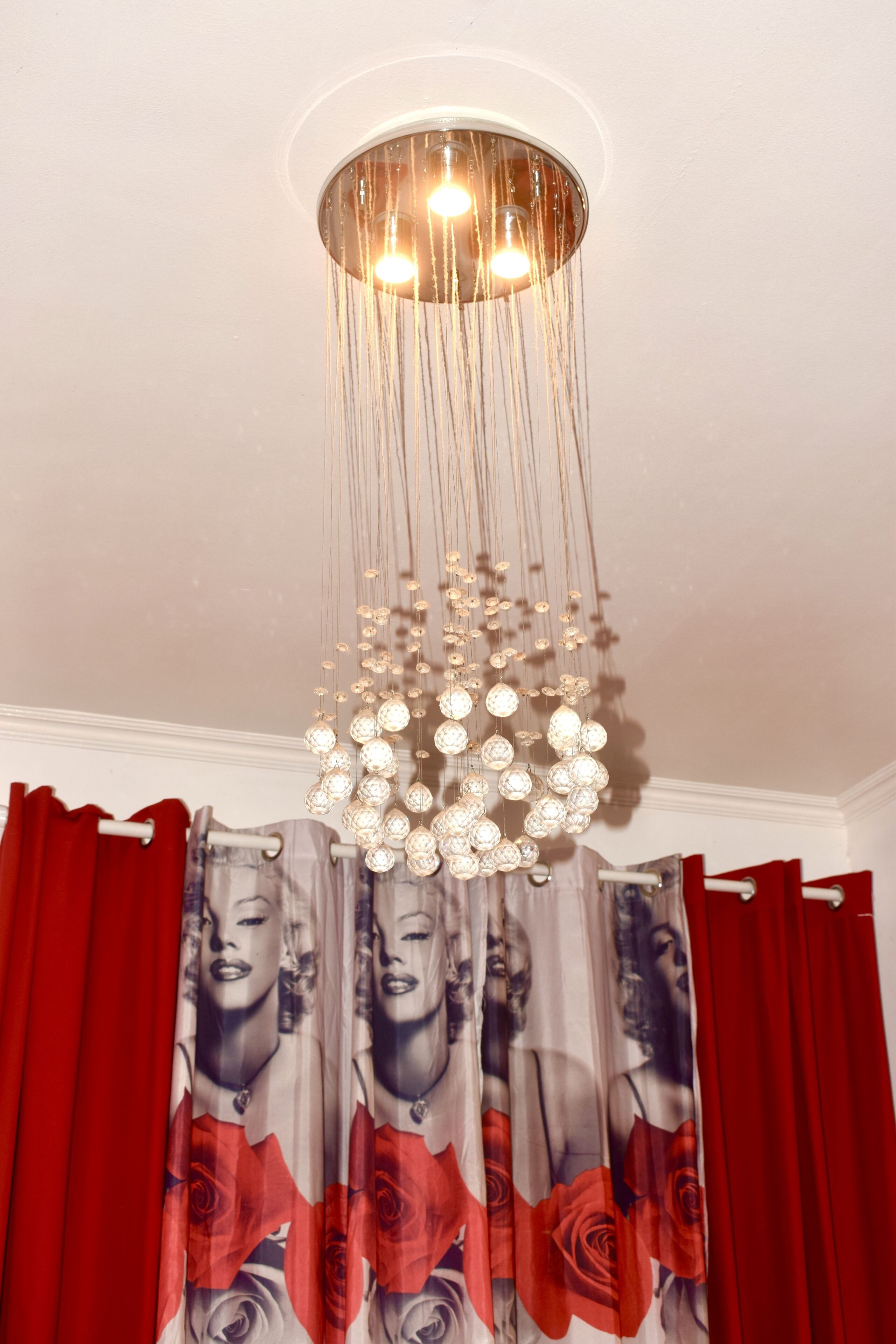 A chandelier with multiple light fixtures hanging from the ceiling.