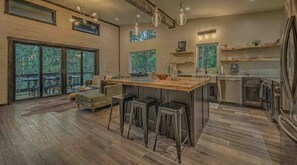 Enjoy cooking in this well-equipped kitchen with a large island and contemporary appliances.