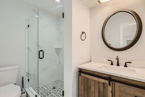 Shower, hair dryer, towels, soap