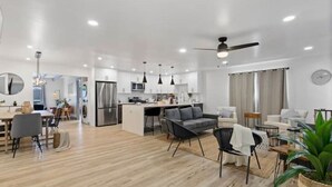 A modern apartment with a kitchen, dining area, and living room. - Outdoor Bar/Jacuzzi/Ocean & Bay Breeze Hideaway (Chula Vista)