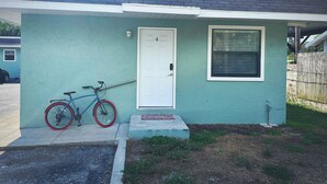 A small single-story house with a white door and a window with blinds. - Bikes, Beaches and Quaint Floridian Downtowns (Palm Harbor)