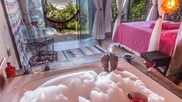 Romantic Suite, 1 Bedroom, Jetted Tub, Sea View | 1 bedroom, minibar, in-room safe, individually furnished