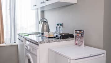 Mini-fridge, stovetop, griddle, cookware/dishes/utensils