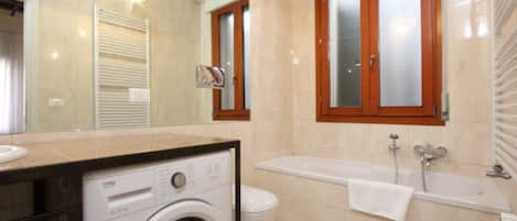 Bathtub, hair dryer, towels