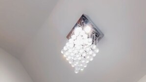 A ceiling with a modern light fixture.