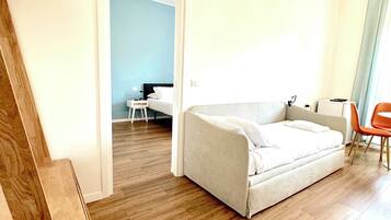 Suite familiar (1) | Zona de estar | Una televisión de pantalla plana