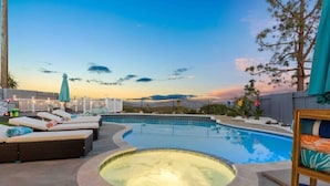 A swimming pool with lounge chairs and a hot tub, surrounded by a fence and trees. - Upscale Resort House /Views, Saltwater Pool/Spa !
 (Spring Valley)