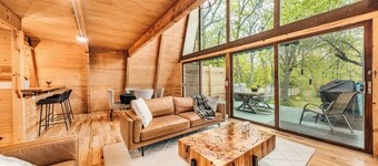 Rustic Riverside A-Frame Retreat: Secluded Charm.