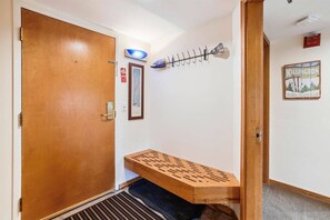 Entryway and Ski Bench - Convenient entry area with bench seating and hooks for coats and ski gear.