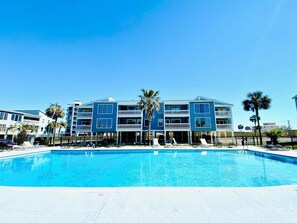 A swimming pool with a clear blue sky above.
