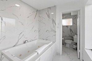 Bathtub, hair dryer, towels