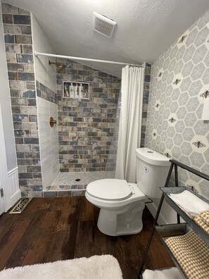 Shower, hair dryer, towels, soap