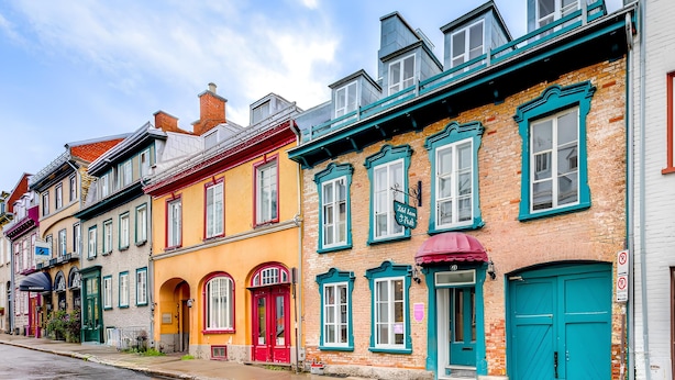 A row of colorful, historic buildings with distinct architectural styles and vibrant facades.
