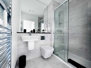 Bathtub, hair dryer, towels