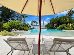 Outdoor pool, pool umbrellas, sun loungers