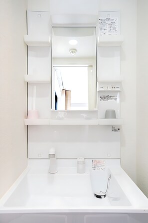 Hair dryer, bidet, towels, soap