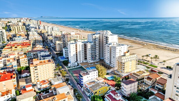 A coastal cityscape with high-rise buildings, a beach, and a clear blue sky. - Holiday Apartment "Soleole8" with Shared Terrace, A/C & Wi-Fi (Gandia)